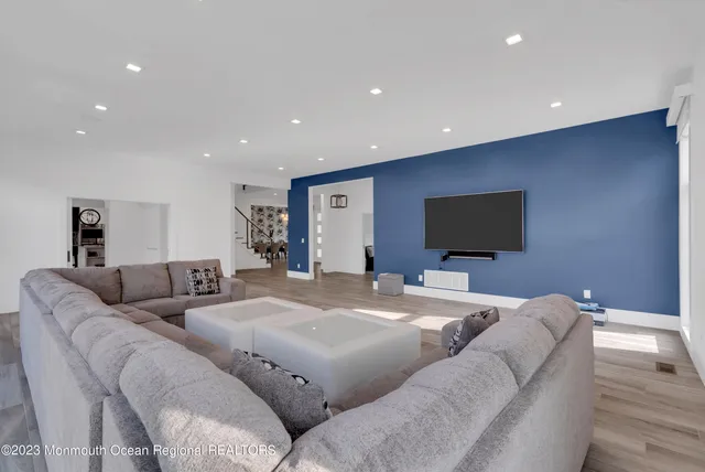 a living room with a couch and a flat screen tv