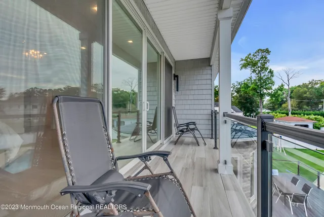 a view of balcony with furniture