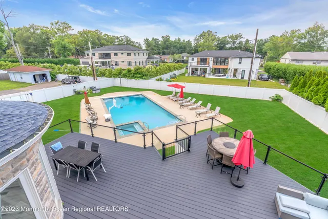 an aerial view of a chairs and table on the terrace