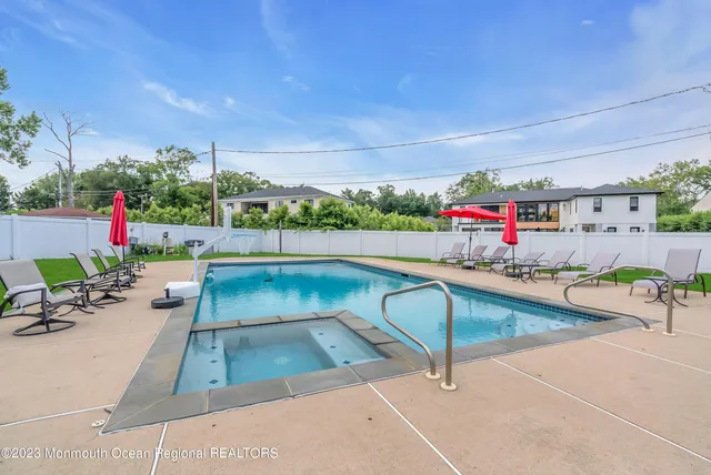 a view of a swimming pool from a lounge chair