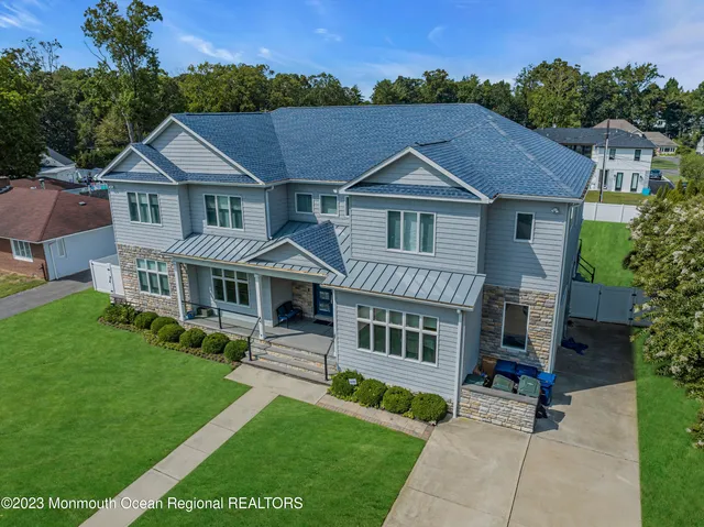 a aerial view of a house with a yard