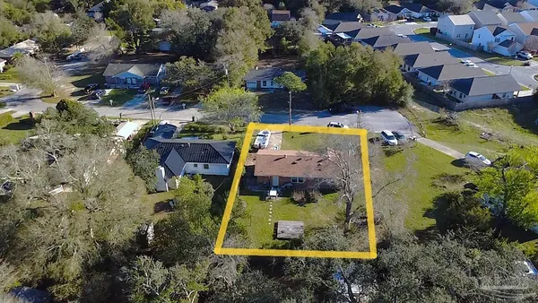 an aerial view of a house with a garden