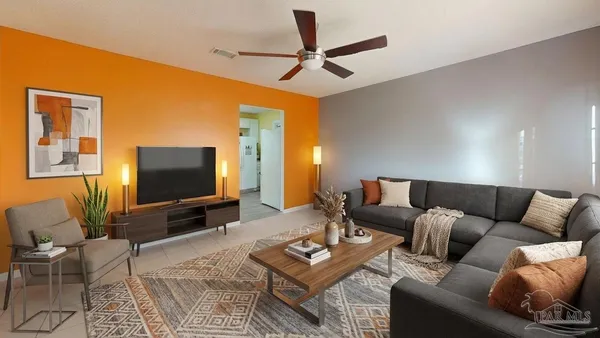 a living room with furniture and a flat screen tv