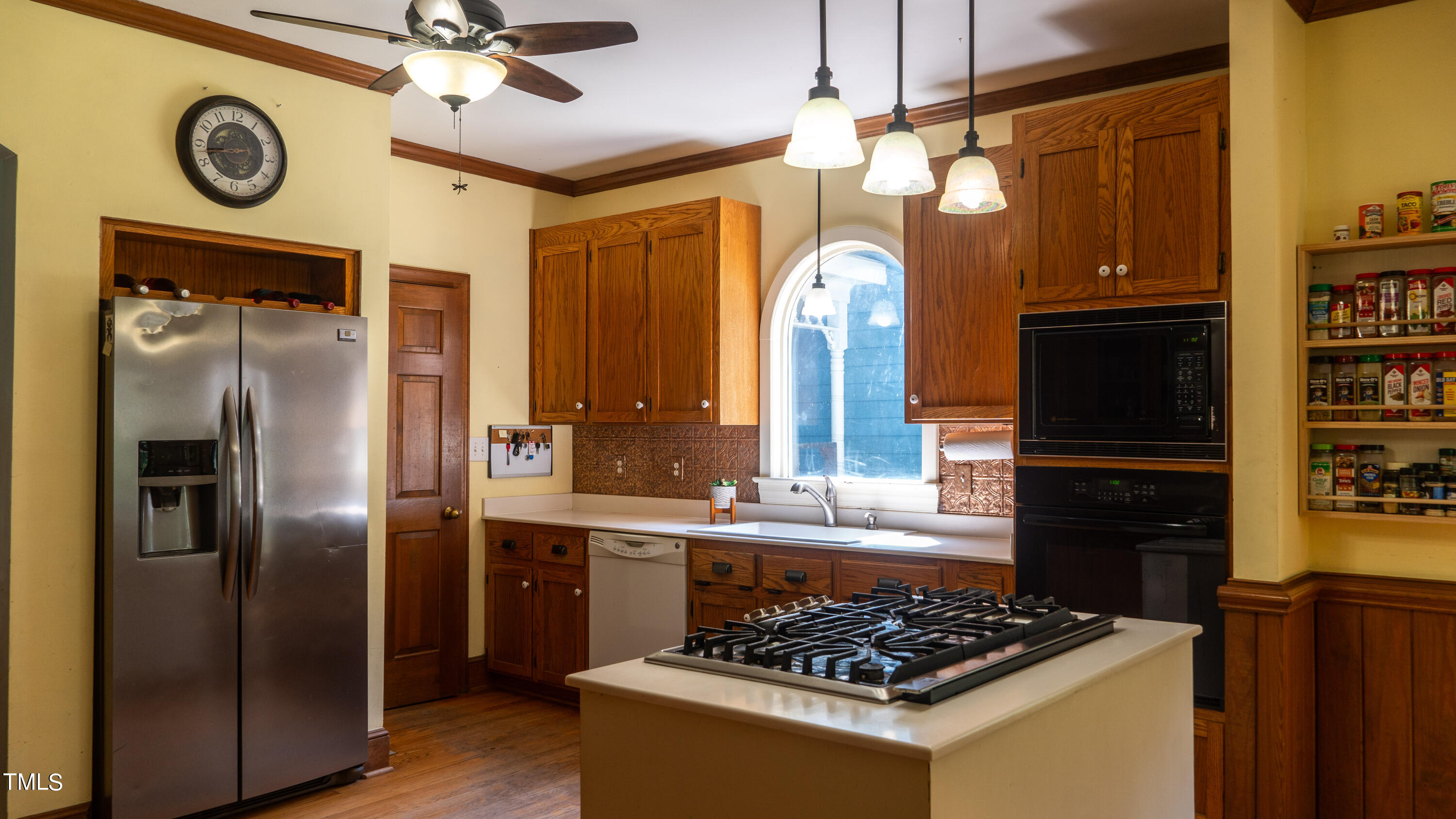 928 Windrow Lane Raleigh, NC 27603 - Photo 18 of 47 a kitchen with stainless steel appliances granite countertop a refrigerator a stove and a microwave