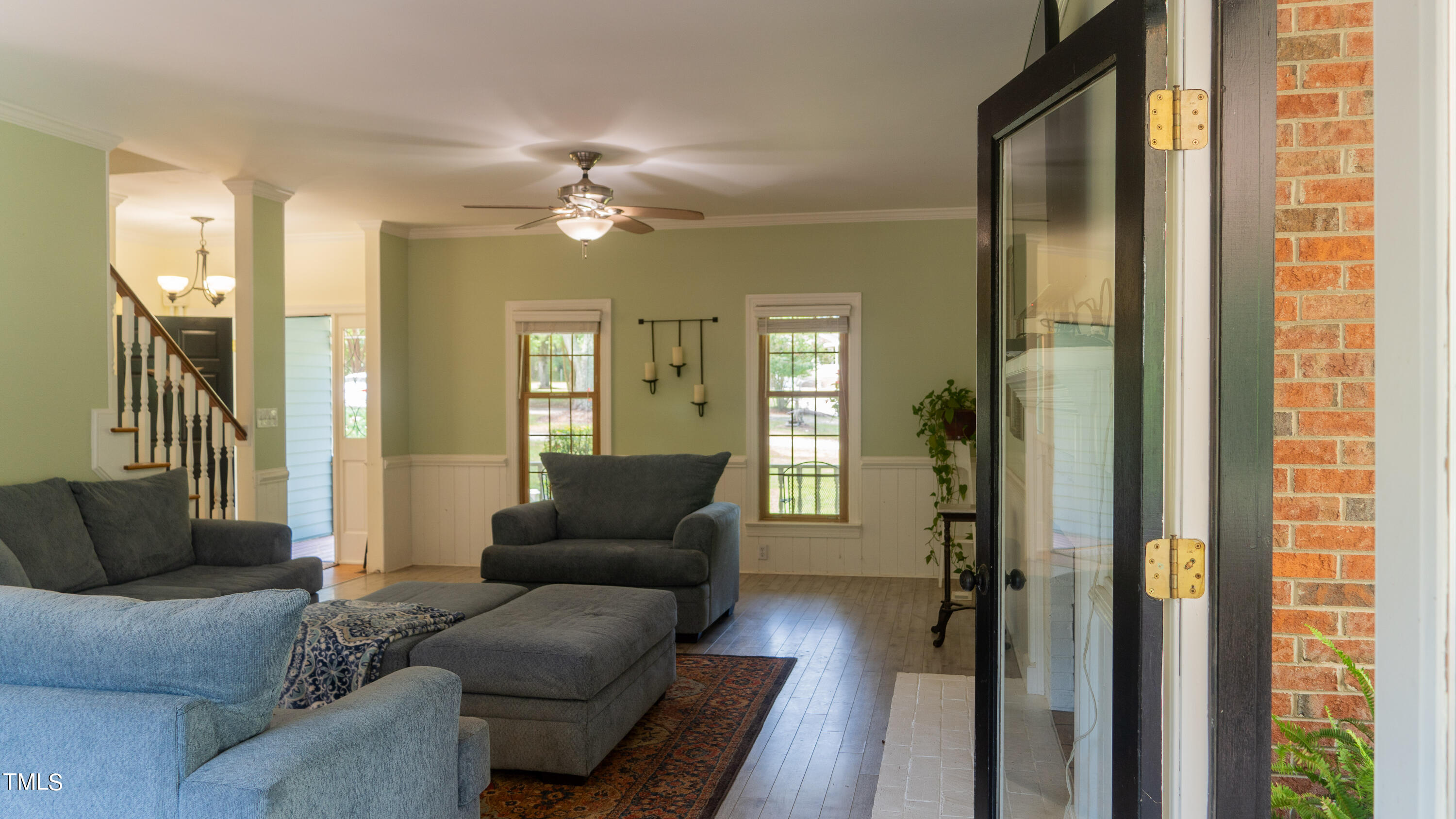 928 Windrow Lane Raleigh, NC 27603 - Photo 28 of 47 a living room with furniture and a chandelier