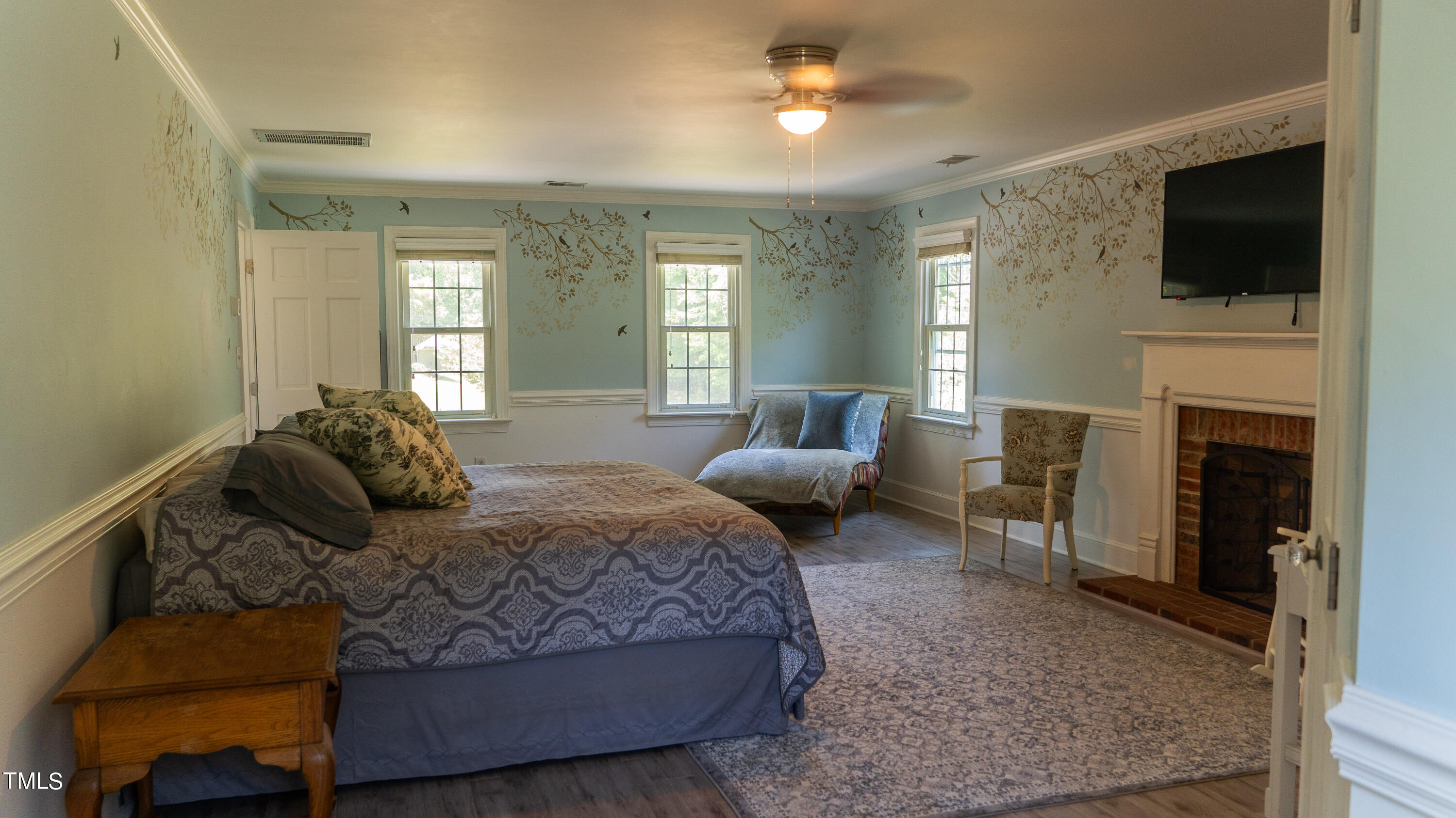 928 Windrow Lane Raleigh, NC 27603 - Photo 32 of 47 a living room with furniture and a flat screen tv