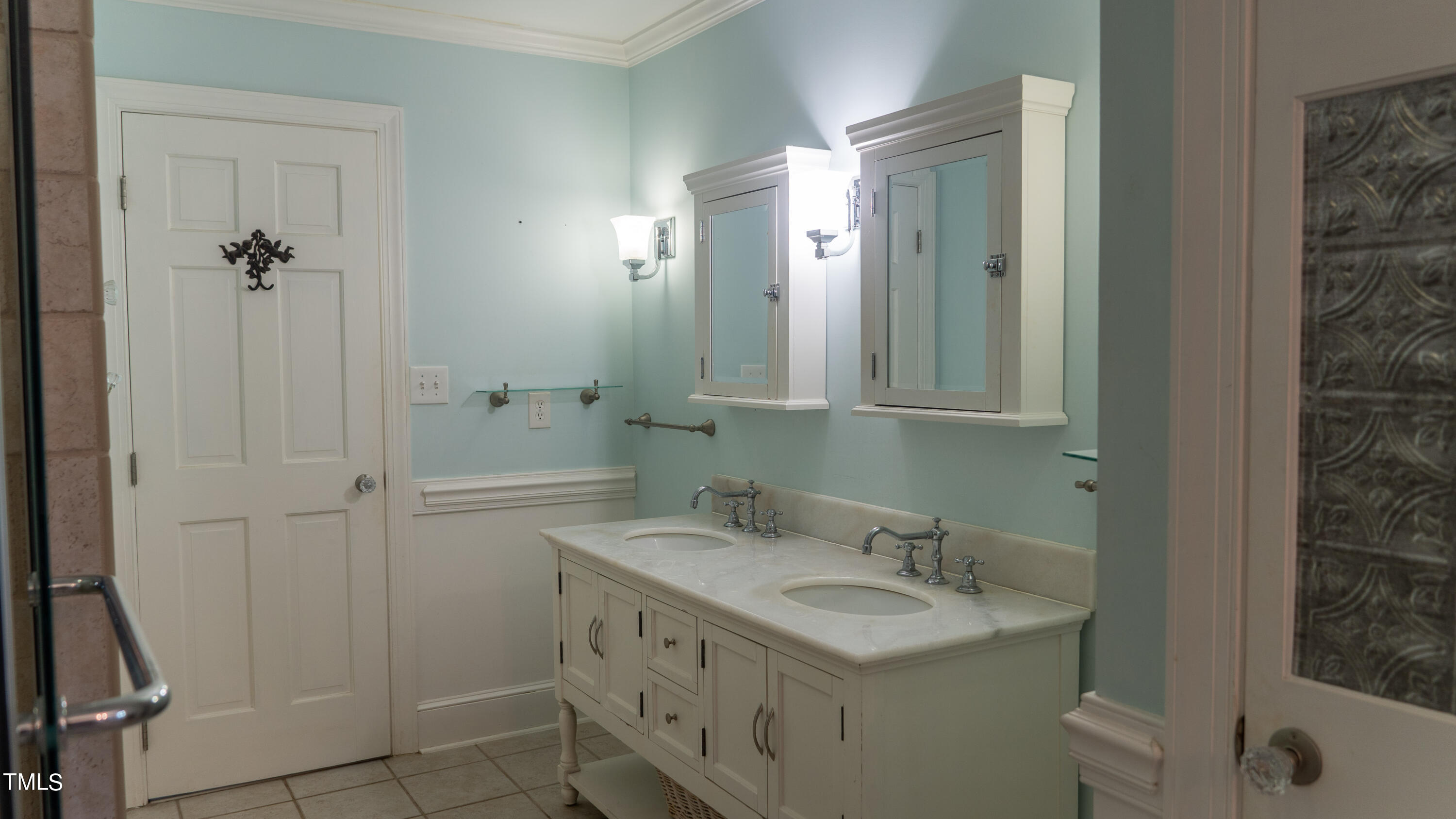 928 Windrow Lane Raleigh, NC 27603 - Photo 35 of 47 a bathroom with a sink and a mirror
