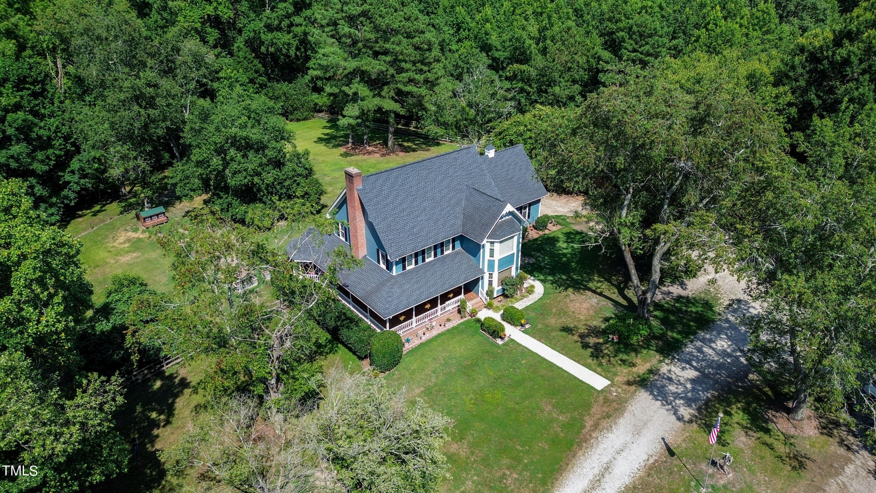 928 Windrow Lane Raleigh, NC 27603 - Photo 43 of 47 an aerial view of a house with yard and trees in the background