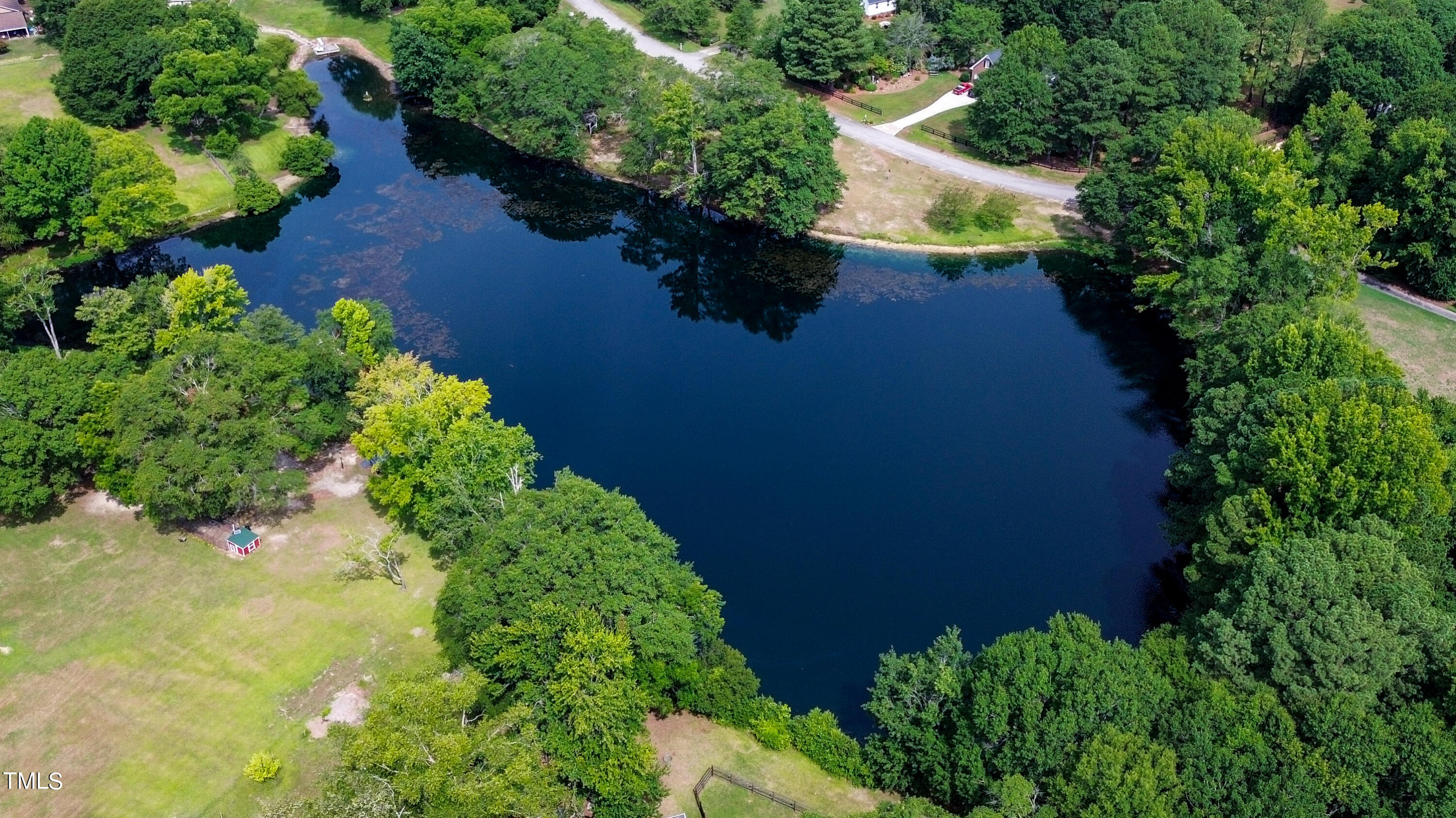 928 Windrow Lane Raleigh, NC 27603 - Photo 47 of 47 an aerial view of a house with a yard and lake view