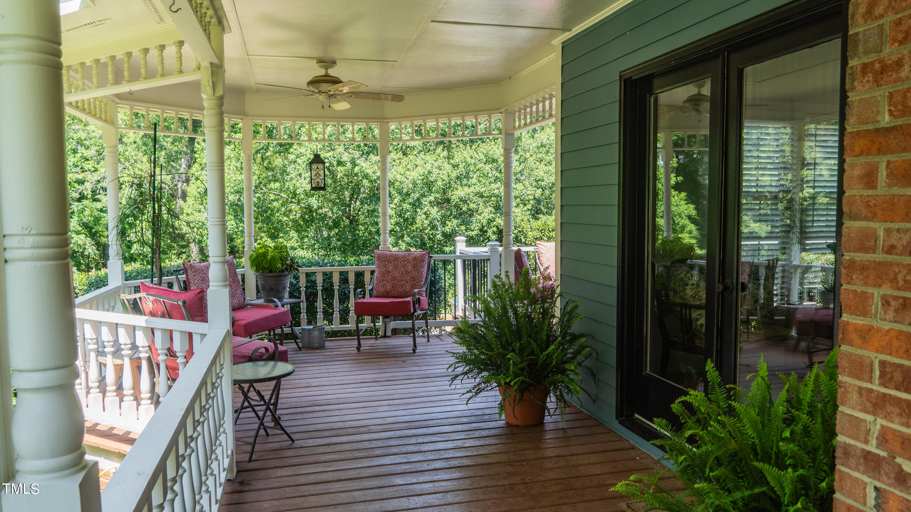 928 Windrow Lane Raleigh, NC 27603 - Photo 8 of 47 a balcony with furniture and wooden floor