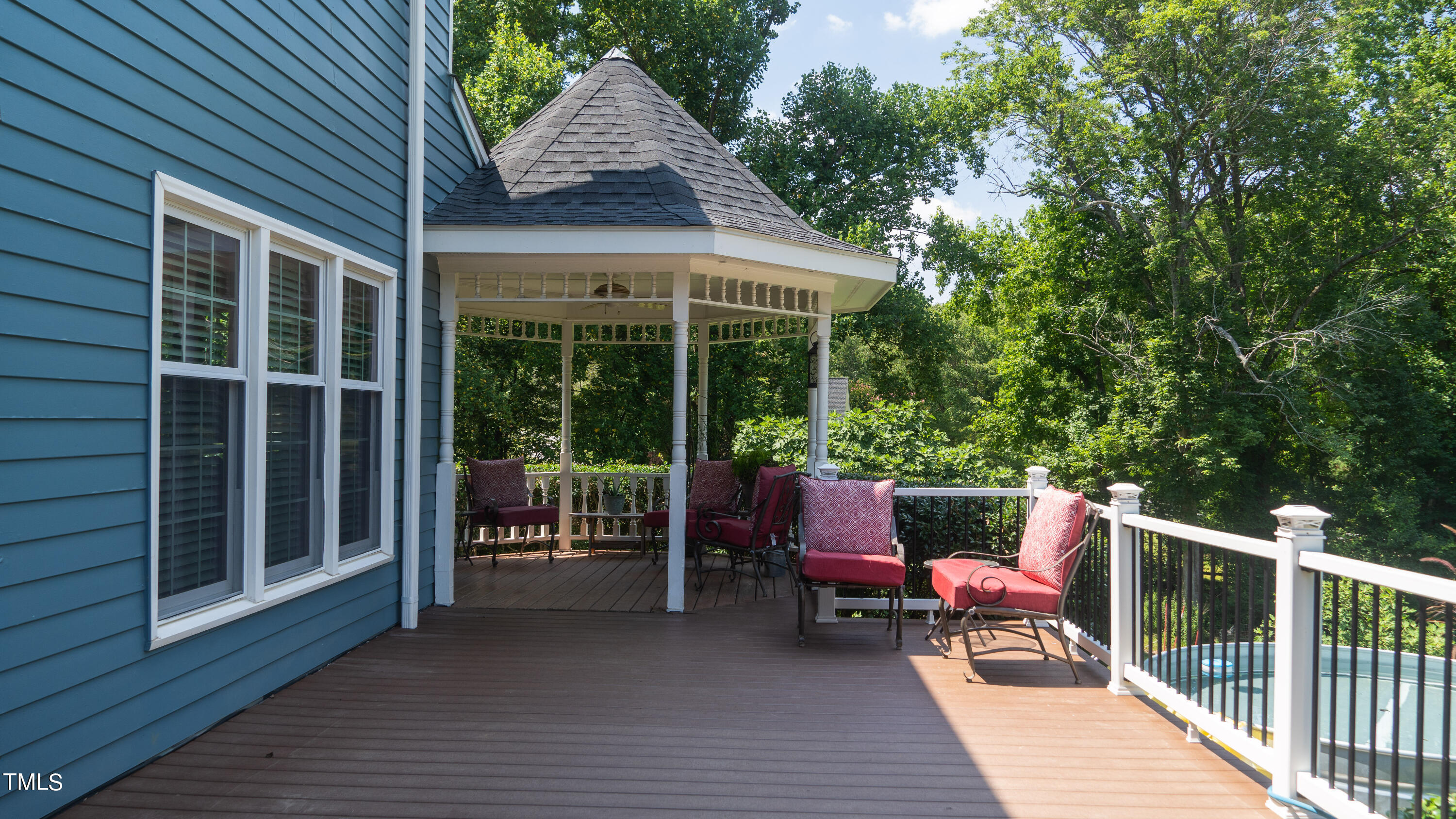 928 Windrow Lane Raleigh, NC 27603 - Photo 10 of 47 a patio with wooden floor a yard a table and chairs