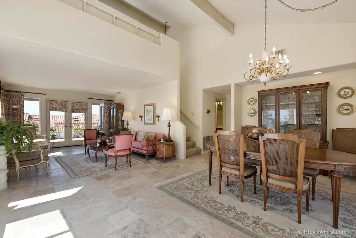 4173 Rhodes Way Oceanside, CA 92056 - Photo 5 of 25 Wide entry into main living area. Window seat and garden windows. Opens to private back patio. Travertine stone floors. Spacious formal dining area.