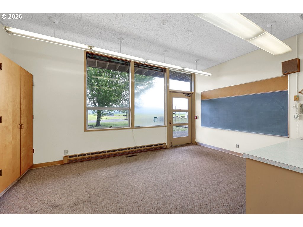 21211 Coburg Road Harrisburg, OR 97446 - Photo 21 of 48 a view of an empty room with a window