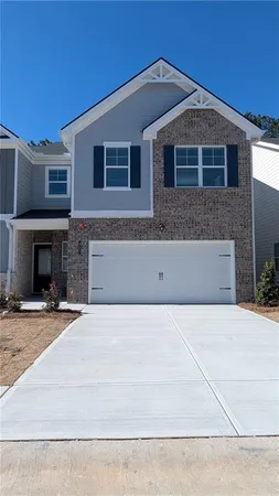 a front view of a house with yard