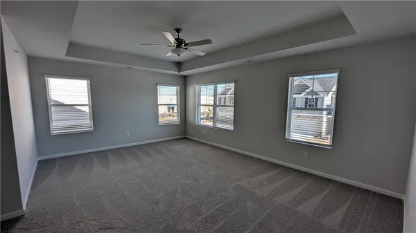 a view of an empty room with windows