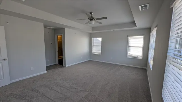 an empty room that has a window in it