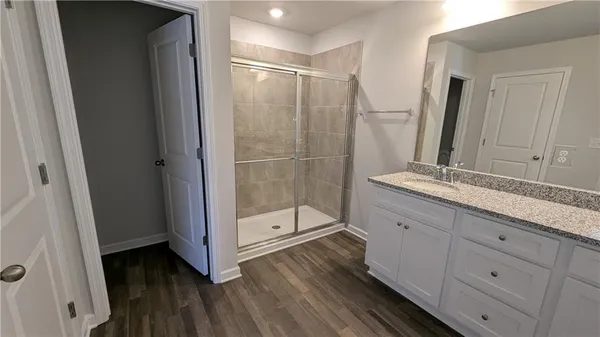 a bathroom with a double vanity sink and mirror