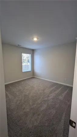a view of an empty room and window