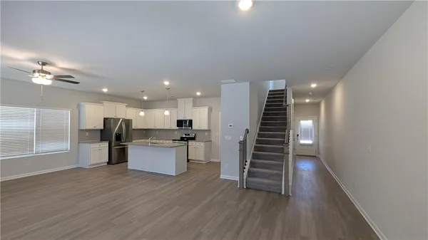 a view of kitchen with sink and wooden floor