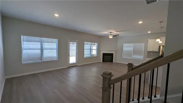 a view of entryway and hall with wooden floor