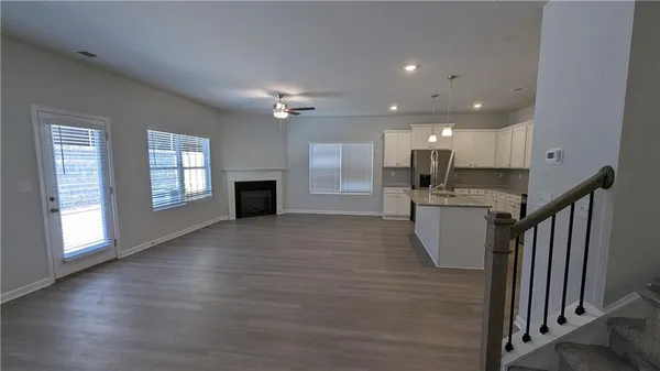 a view of a kitchen with a sink and a window