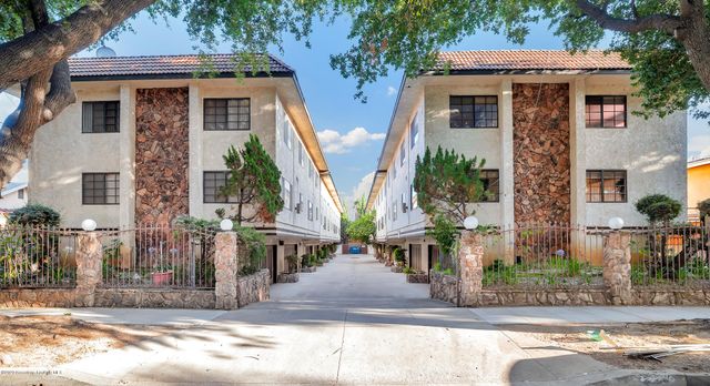 a front view of a house with street