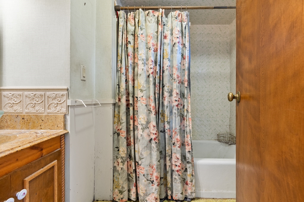 94 Gordon Road Braintree, MA 02184 - Photo 11 of 25 a bathroom with a granite countertop shower and a sink