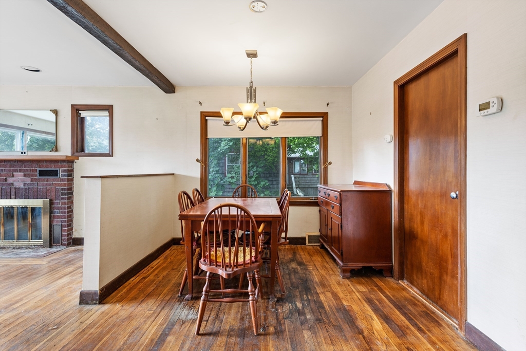 94 Gordon Road Braintree, MA 02184 - Photo 17 of 25 a dining room with furniture a chandelier and wooden floor