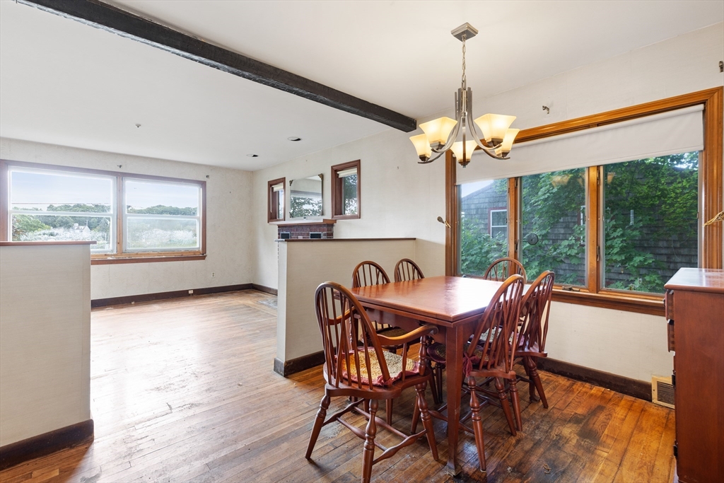 94 Gordon Road Braintree, MA 02184 - Photo 18 of 25 a dining room with furniture a chandelier and wooden floor