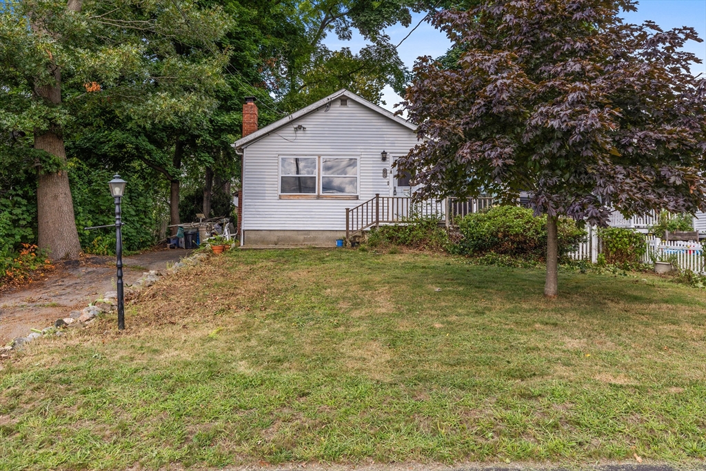 94 Gordon Road Braintree, MA 02184 - Photo 2 of 25 a view of a house with a yard