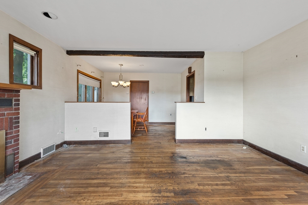 94 Gordon Road Braintree, MA 02184 - Photo 21 of 25 a view of a room with wooden floor and staircase