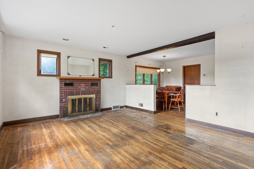 94 Gordon Road Braintree, MA 02184 - Photo 25 of 25 a living room with furniture and a fireplace