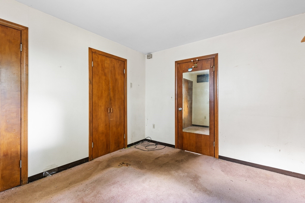 94 Gordon Road Braintree, MA 02184 - Photo 7 of 25 a view of an empty room with closet and a window