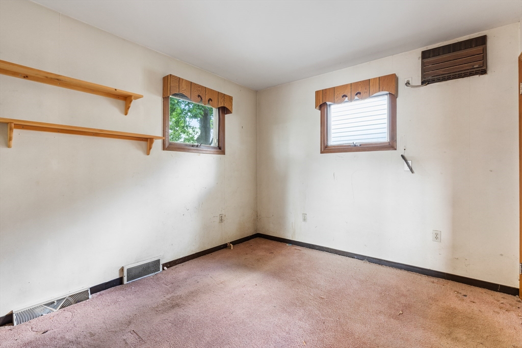 94 Gordon Road Braintree, MA 02184 - Photo 8 of 25 an empty room with windows