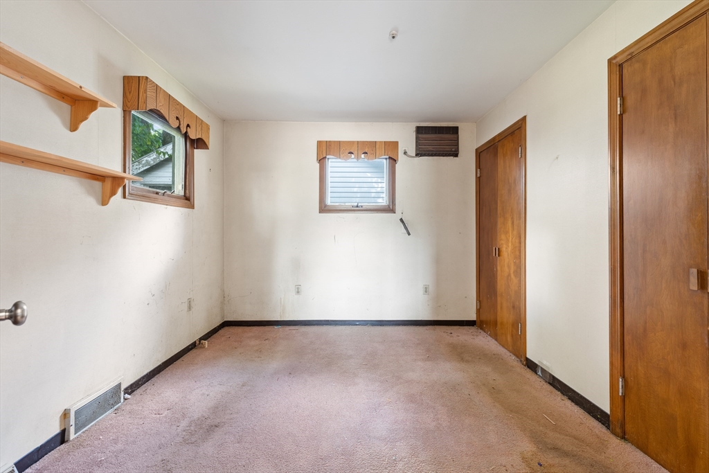 94 Gordon Road Braintree, MA 02184 - Photo 9 of 25 an empty room with windows and closet