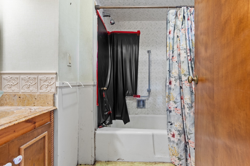 94 Gordon Road Braintree, MA 02184 - Photo 10 of 25 a bathroom with a sink and a mirror