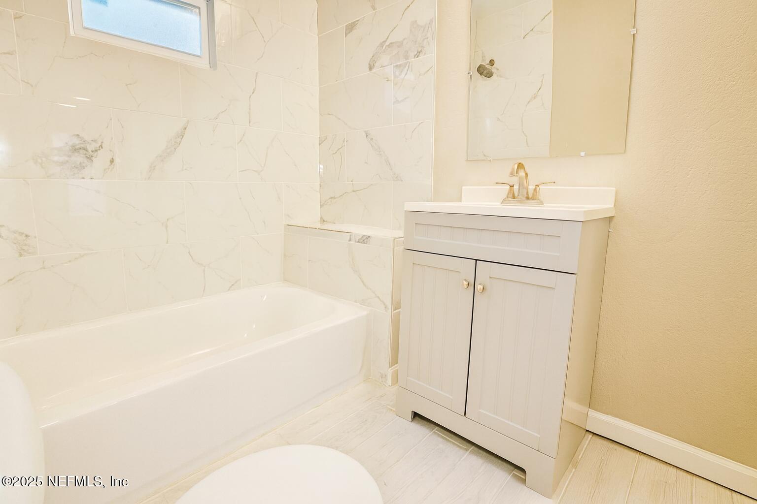 804 Westbrook Road Jacksonville, FL 32209 - Photo 14 of 23 a bathroom with a sink a toilet and shower