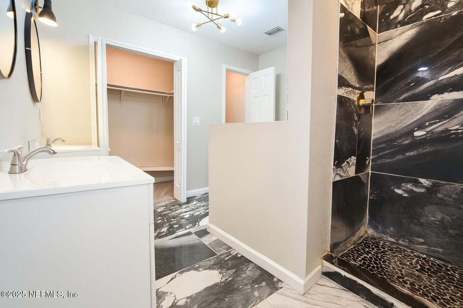 804 Westbrook Road Jacksonville, FL 32209 - Photo 15 of 23 a bathroom with a sink and a mirror