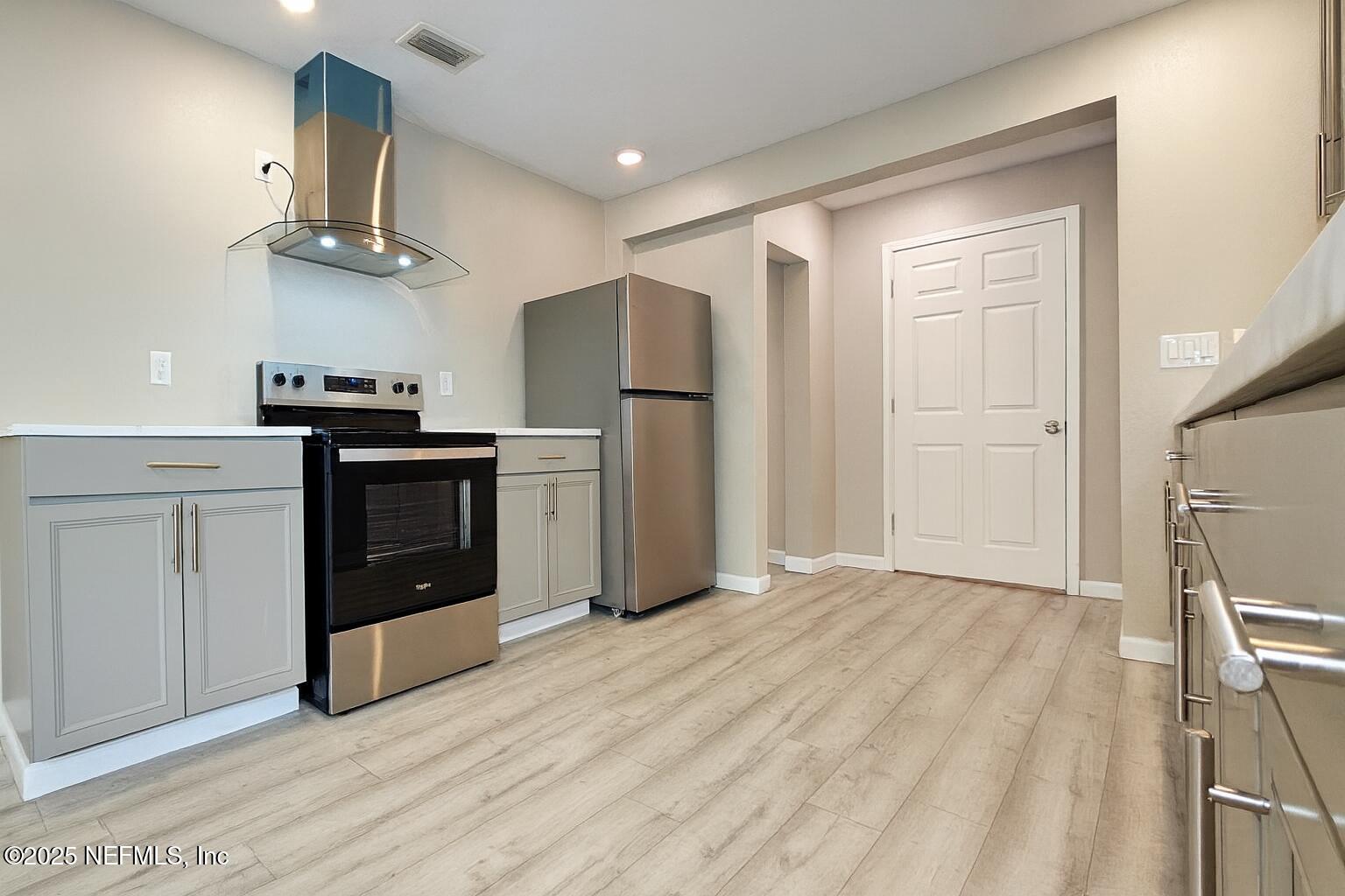 804 Westbrook Road Jacksonville, FL 32209 - Photo 3 of 23 a kitchen with stainless steel appliances granite countertop a refrigerator a stove and a sink