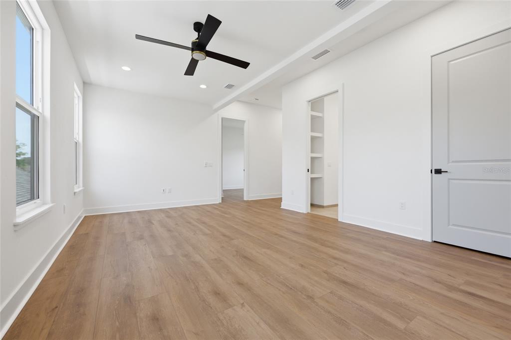 1063 Southwest 135th Way Newberry, FL 32669 - Photo 29 of 42 wooden floor in an empty room with a window