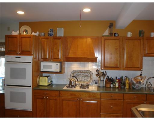 35 Terrace Avenue Riverside, CT 06878 - Photo 6 of 10 a kitchen with a sink a stove and a refrigerator