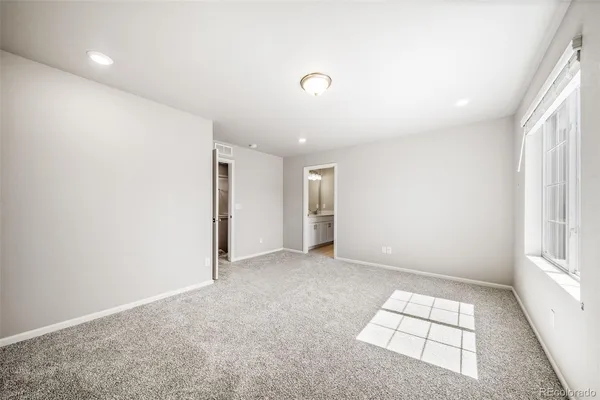 an empty room with windows