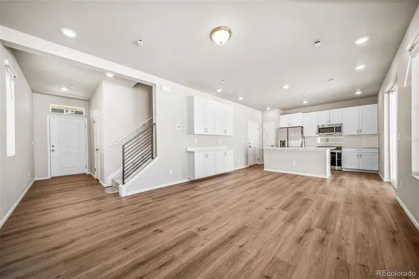 a view of kitchen with wooden floor