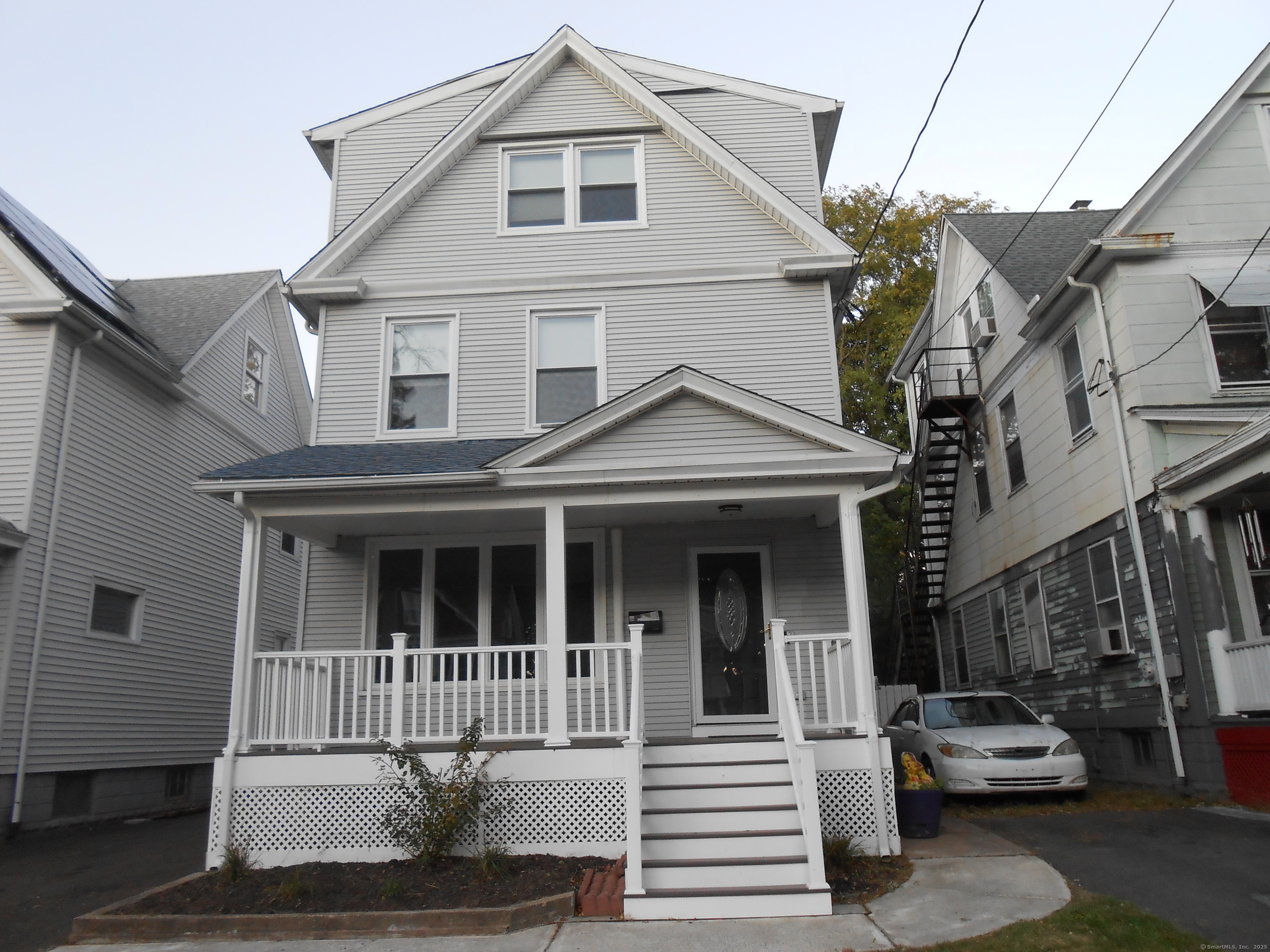631 Whalley Avenue New Haven, CT 06511 - Photo 1 of 28 a view of a house with a cars park side of a road