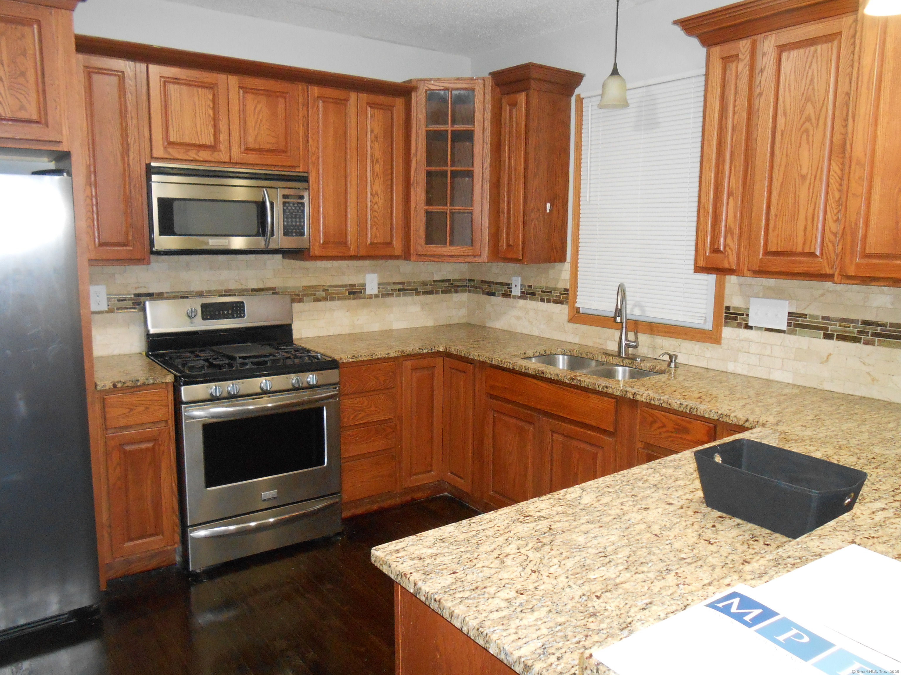 631 Whalley Avenue New Haven, CT 06511 - Photo 11 of 28 a kitchen with stainless steel appliances granite countertop a sink stove and microwave