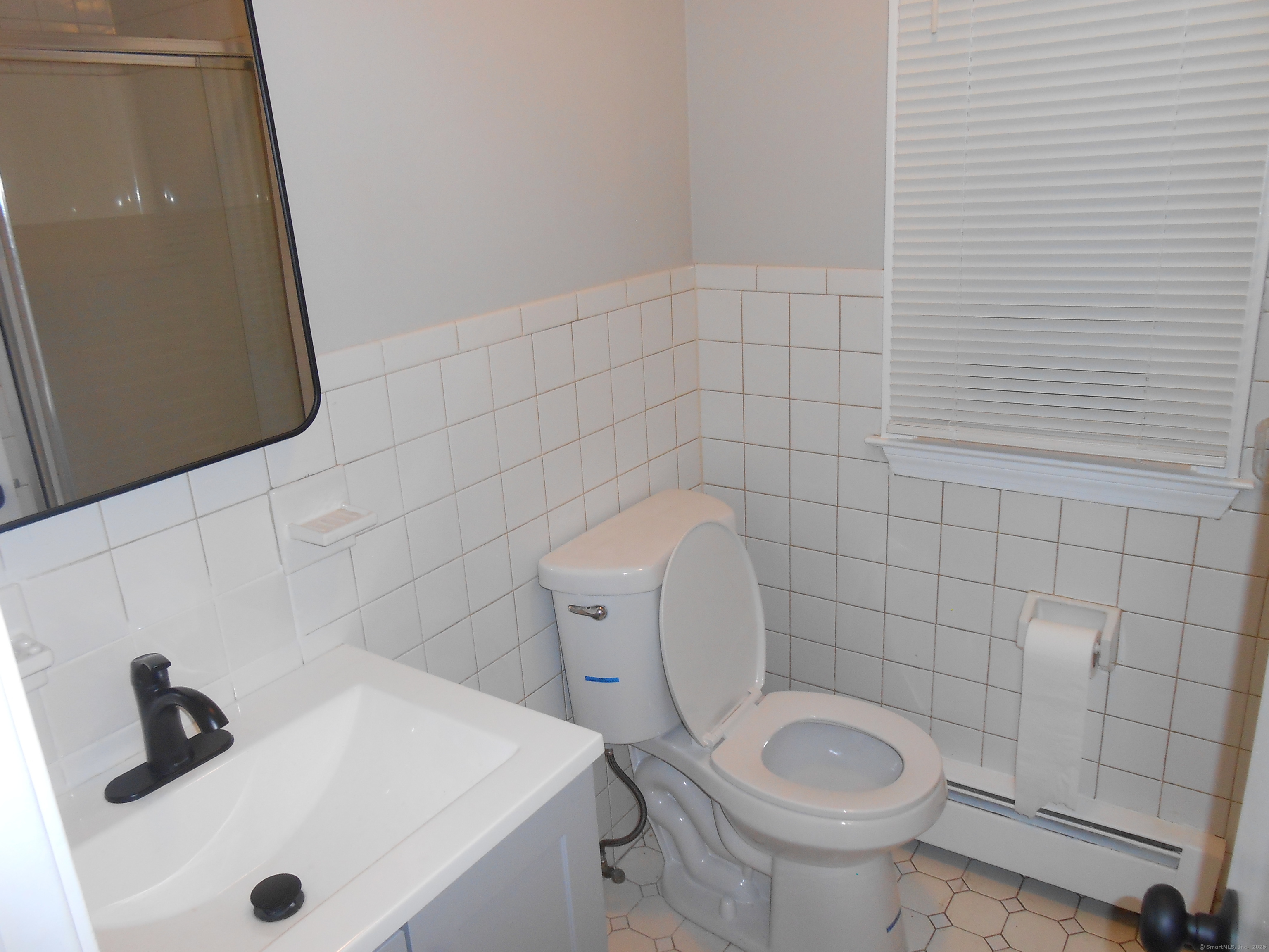 631 Whalley Avenue New Haven, CT 06511 - Photo 16 of 28 a bathroom with a sink and a toilet