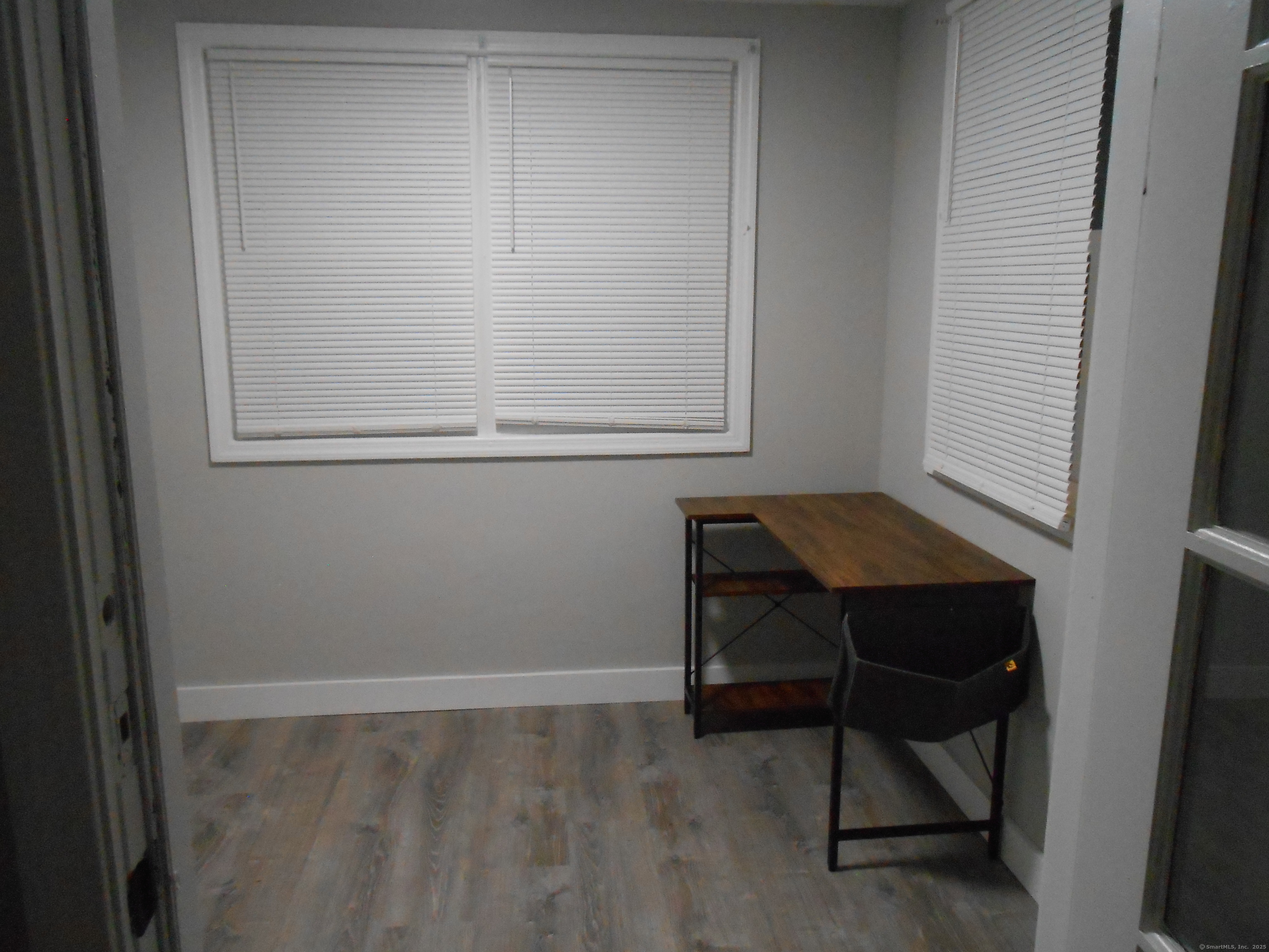 631 Whalley Avenue New Haven, CT 06511 - Photo 18 of 28 a room that has a table and chair in it