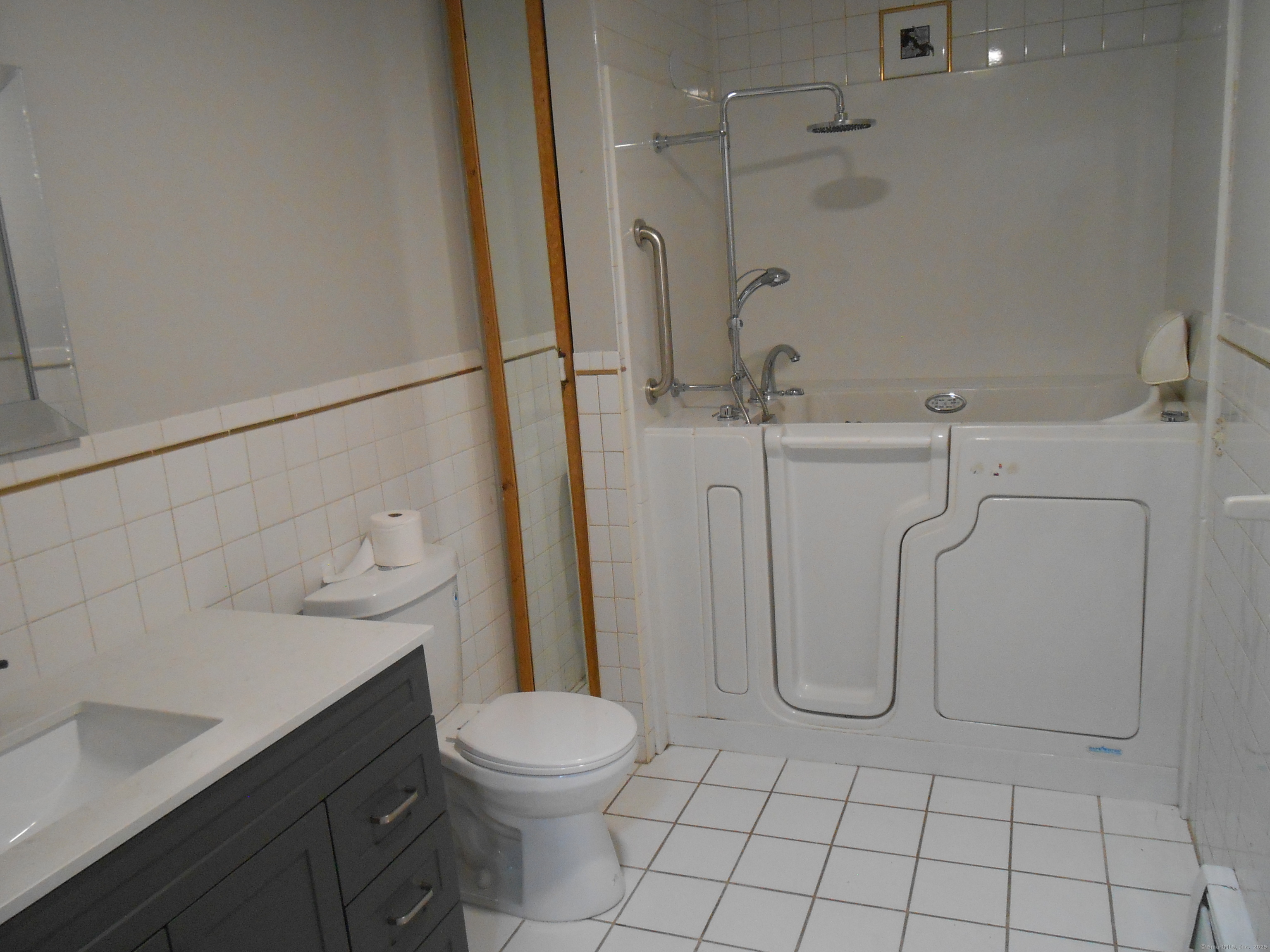 631 Whalley Avenue New Haven, CT 06511 - Photo 24 of 28 a bathroom with a granite countertop sink a toilet and shower