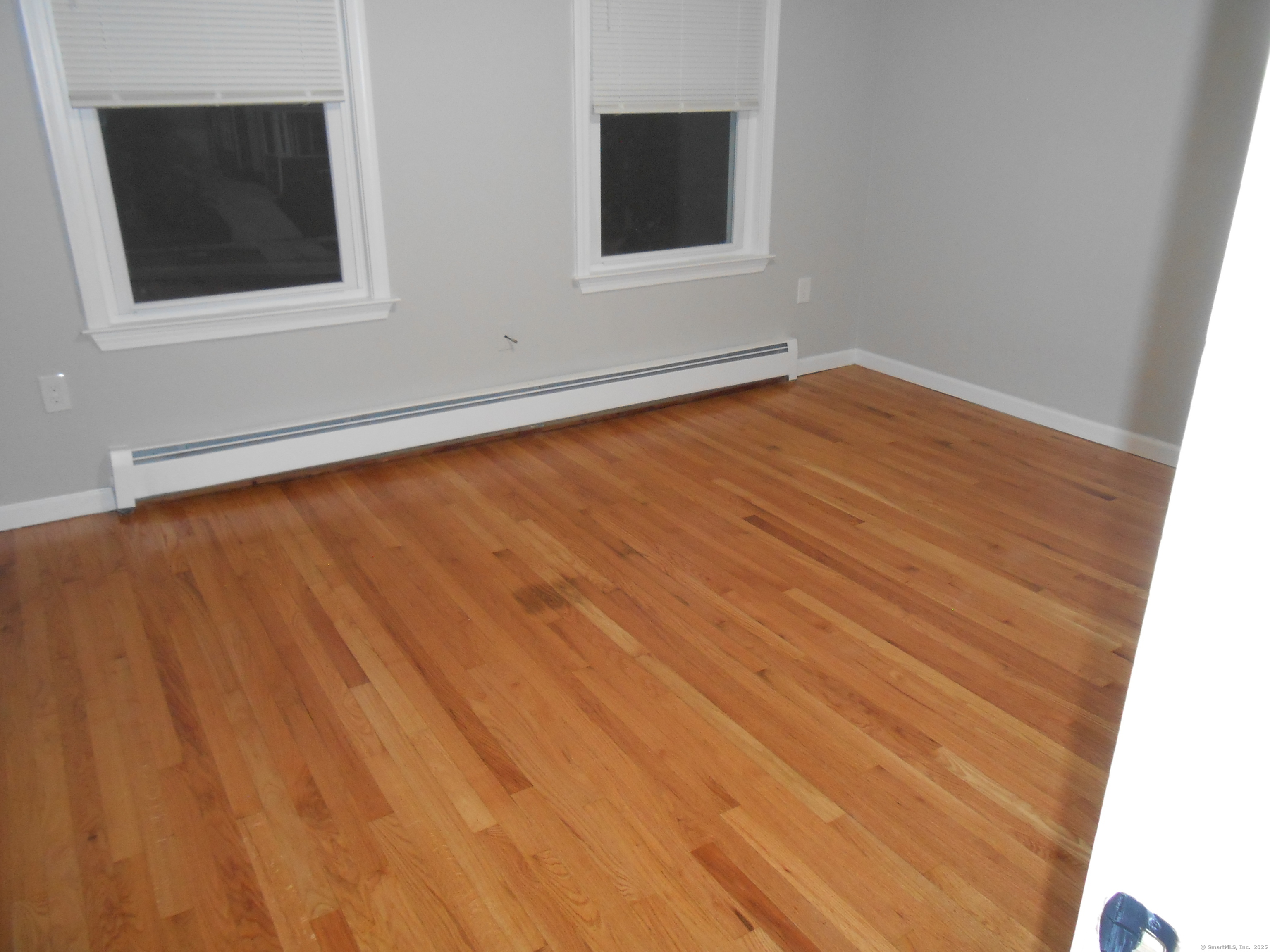 631 Whalley Avenue New Haven, CT 06511 - Photo 28 of 28 a view of an empty room with wooden floor and a window