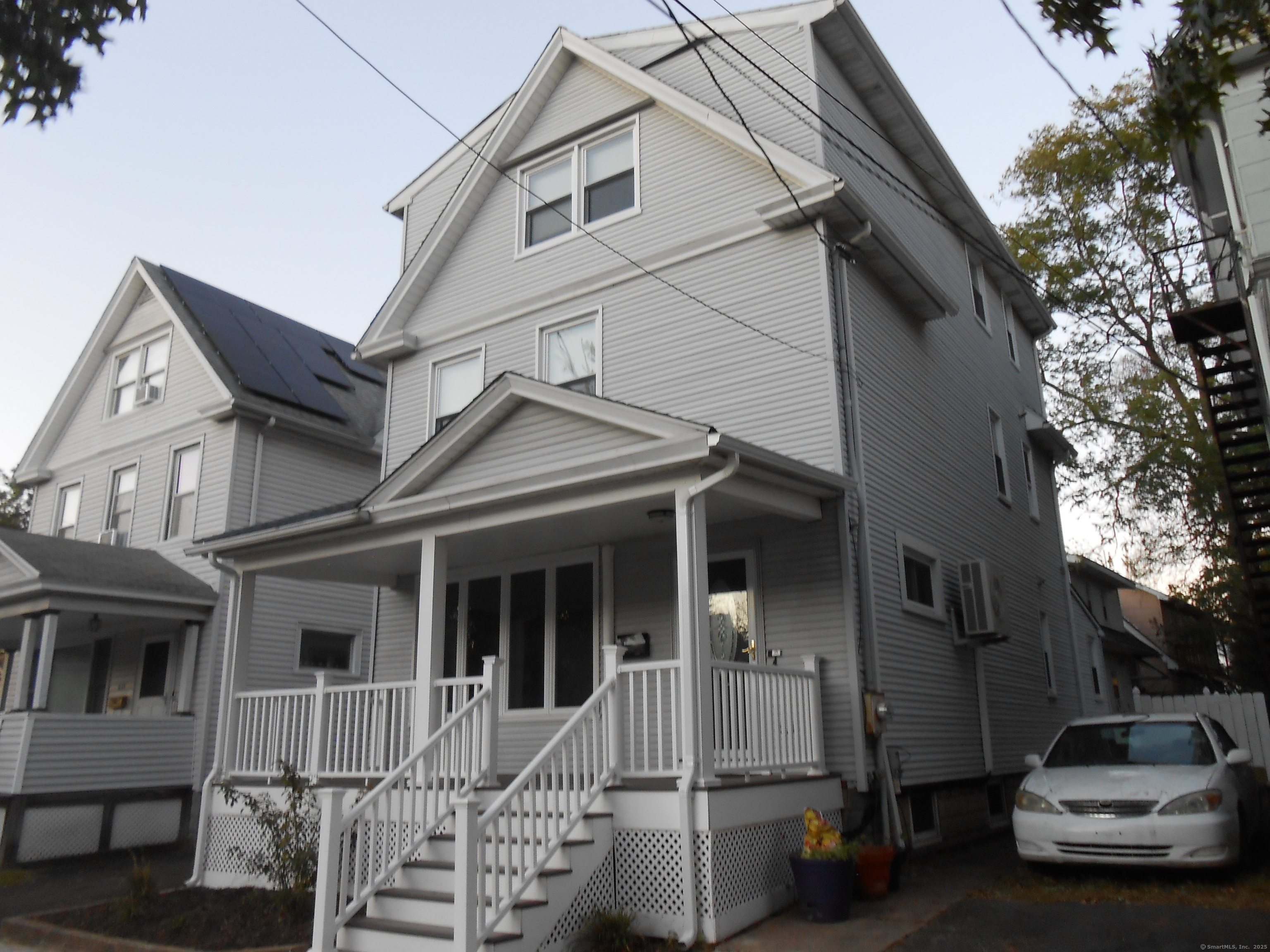 631 Whalley Avenue New Haven, CT 06511 - Photo 5 of 28 a car parked in front of white house